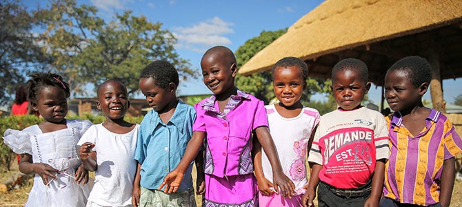 A group of Malawi children pose for a picture as they attend the School for Agriculture For Family Independence graduation.
